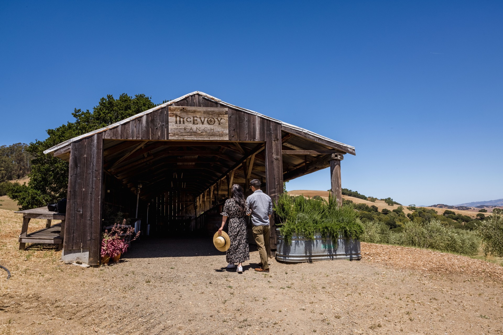 Man and woman walking to barn